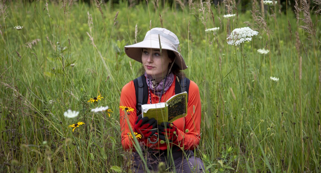 Image of Trent Student sitting in Nature Area