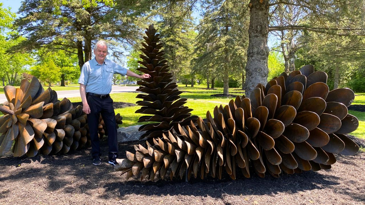 Dr Leo Groarke with Pinecones Sculpture