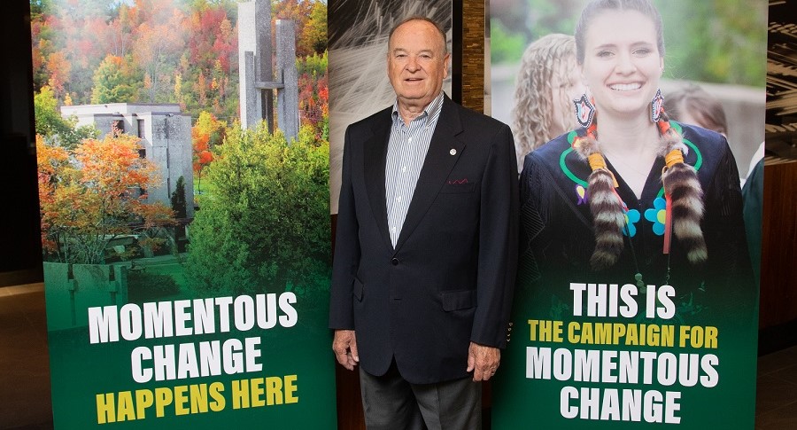 Bryan davies standing in front of momentous change