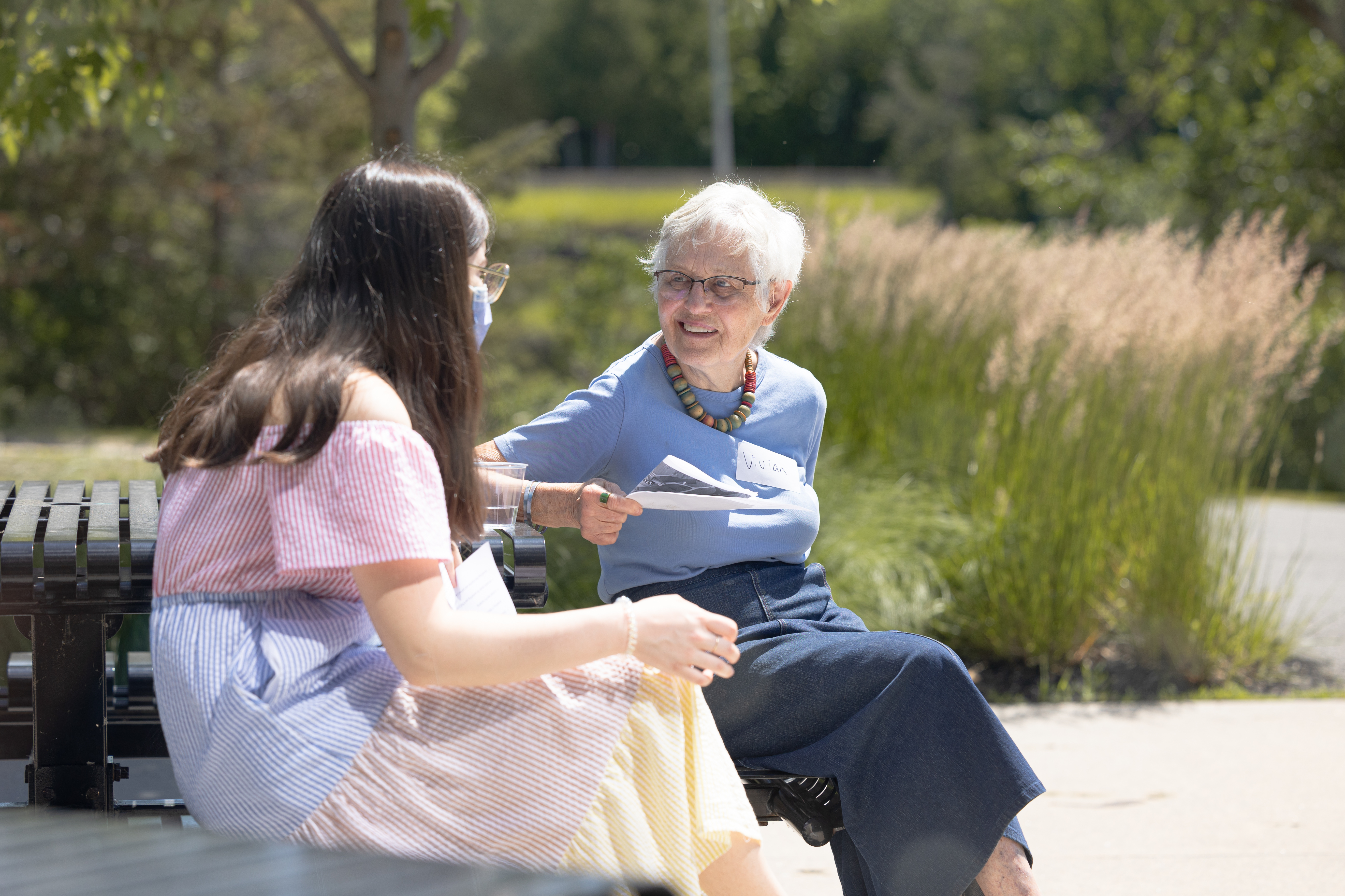 A young lady talking to an older woman