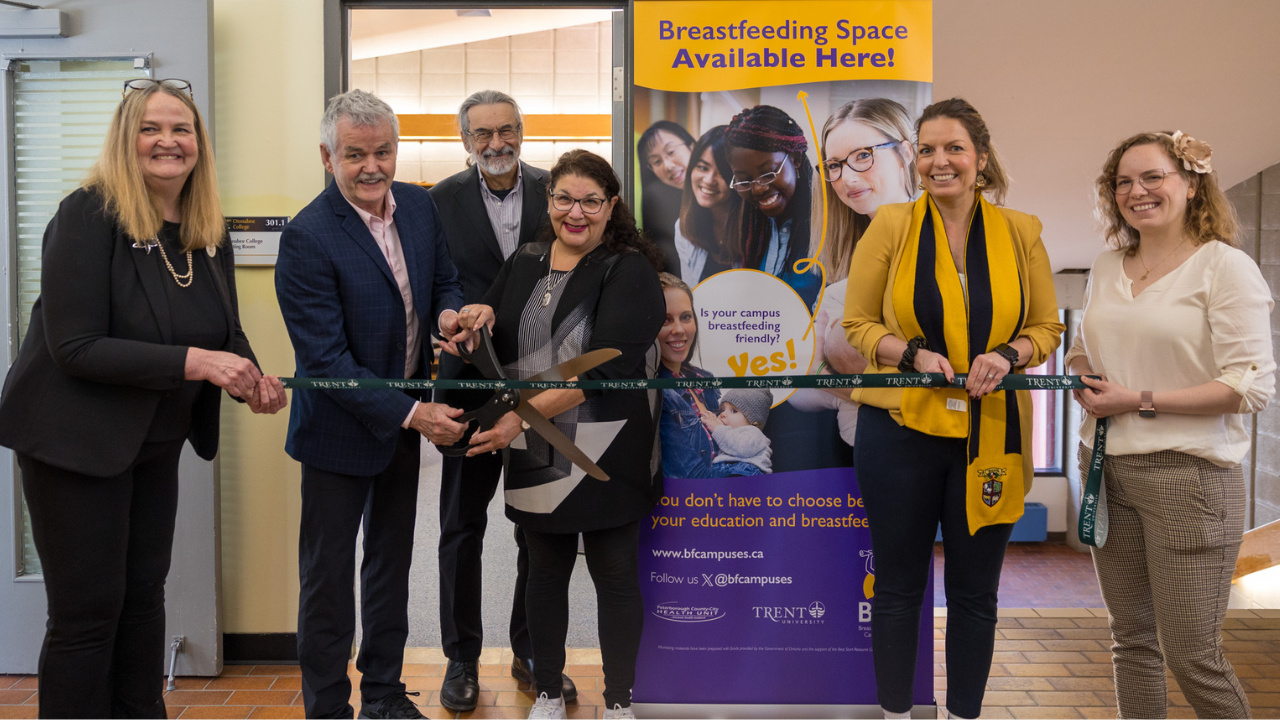 An image of Trent community members cutting the ribbon
