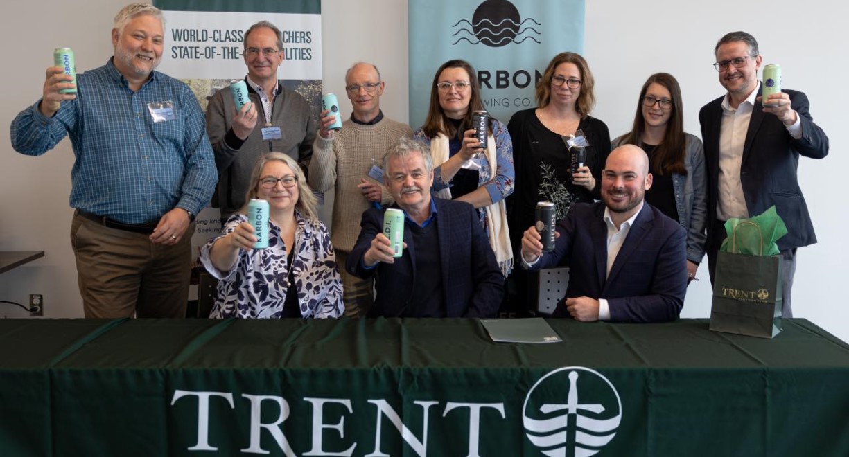 Trent faculty members holding Karbon drinks 